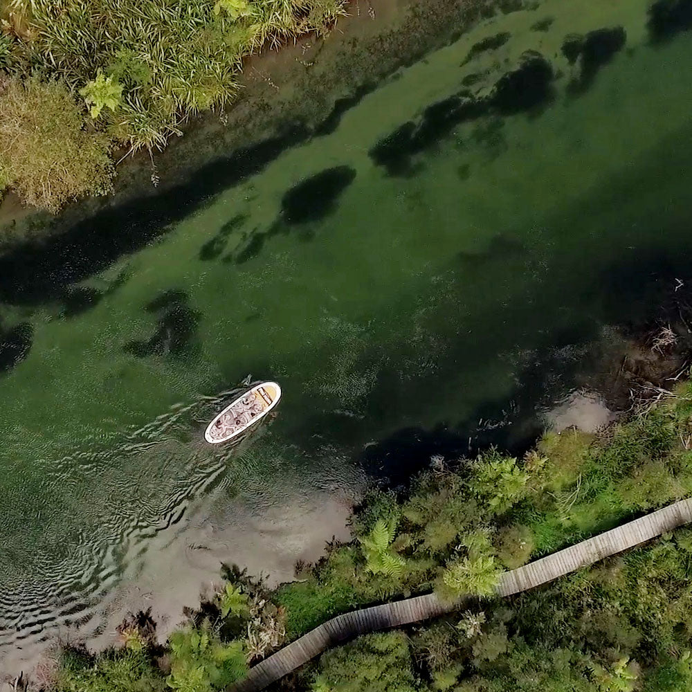 an aerial image of the oahu nui on a river in new zealand surrounded by native bush